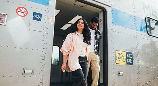 Metrolink customers stepping off the train.